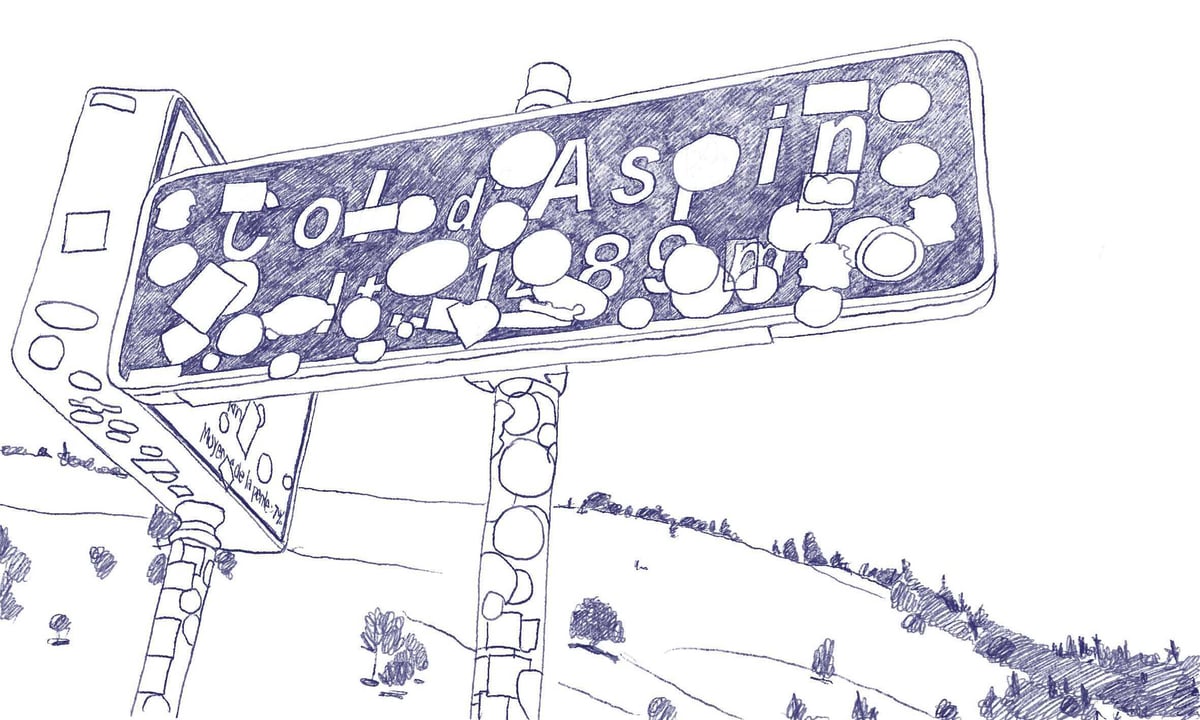 Cycling sign covered in stickers at the Col d'Aspin